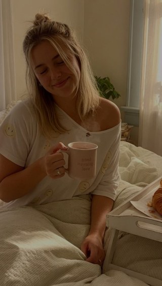 Warm moment — Sunday bed morning with sunlight through sheer curtains.