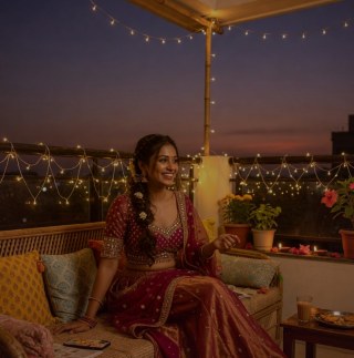 Warm moment — Terrace evening in magenta lehenga with fairy lights and music.